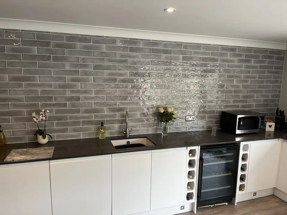Grey glazed brick tile splashback across a kitchen wall, tiled by K.E. Marchant Ceramics in Eastleigh