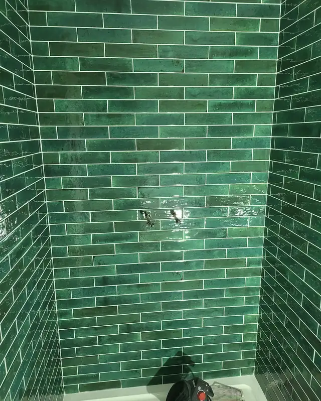 Green glazed brick shower tiles
